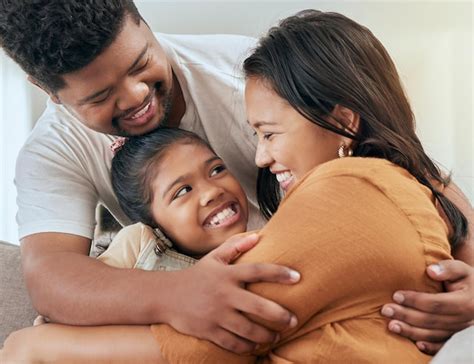 premium photo asian family parents  child hug  sofa bonding love