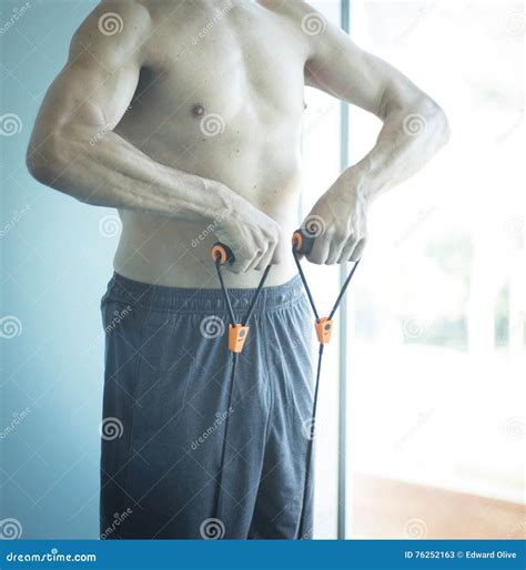 Man exercising nude torso stock image. Image of equipment - 76252163