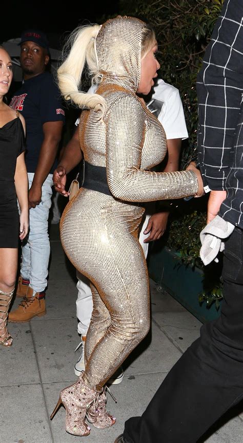 [PICS] Lil Kim Showed Off Her Boobs & Butt In This Gold Jumpsuit