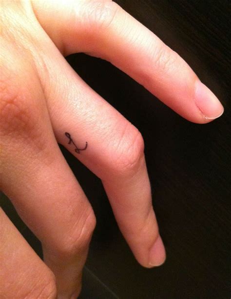 Tiny Inside Finger Tattoos