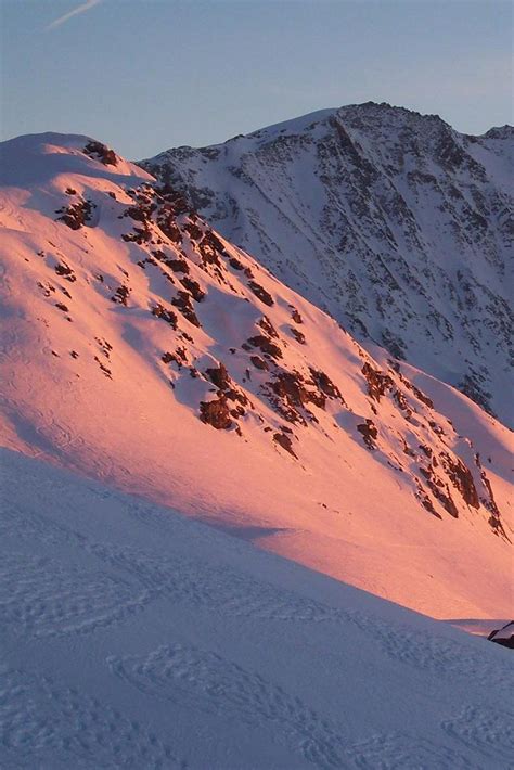 Landscape photography of a snowy mountain sunset, pink, purple and blue ...