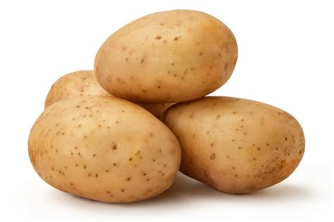 Premium Photo | Several tubers of young potatoes lie on a white ...
