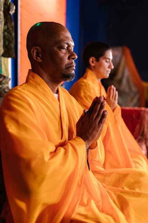 monk  yellow gowns praying  stock photo
