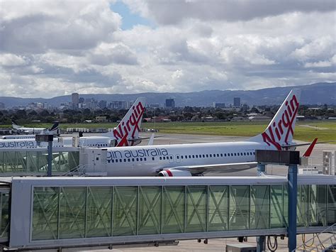Man arrested after allegedly running through Virgin Australia plane naked
