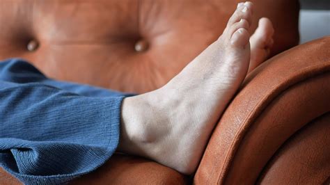 relax women feet lying on sofa in a bright house 36623693 Stock Video