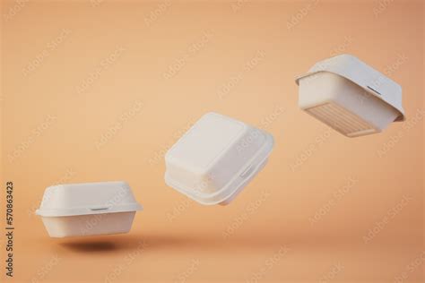 takeaway food. disposable plastic food containers flying across pastel ...