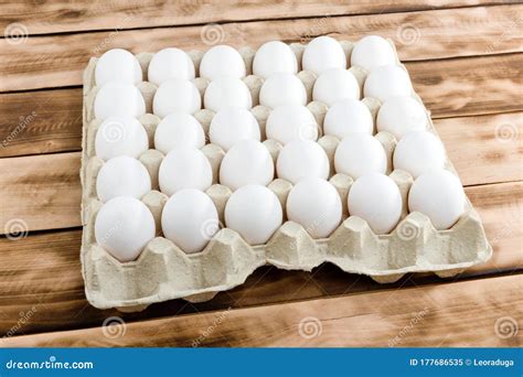 Eggs in Tray of Carton on Wooden Background. Stock Image - Image of board, nature: 177686535