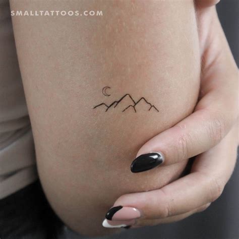 Minimalistic style mountain temporary tattoo located on