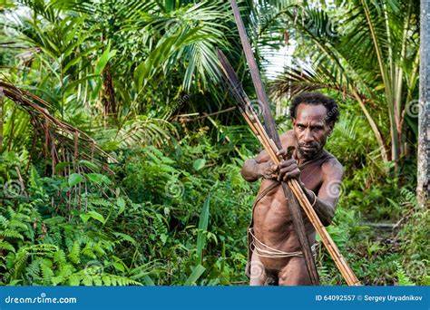 The Papuan From A Korowai Tribe, Live In The Houses Built On Trees. On ...