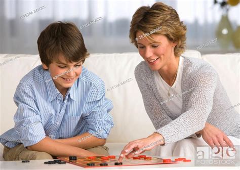Mother and son playing checkers, Stock Photo, Picture And Royalty Free ...