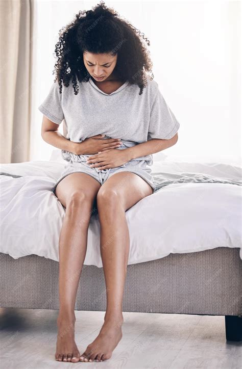 Premium Photo | Black woman stress or stomach ache on house bed home or