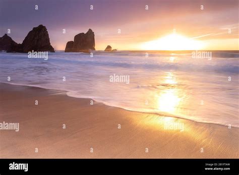 sunset   beach  praia da ursawith  giant ursa  gigante