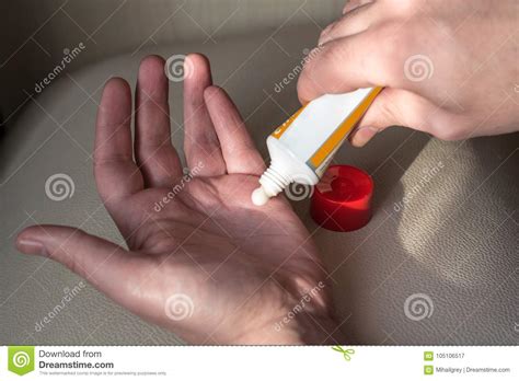 man applying  ointment   tube stock image image  medical