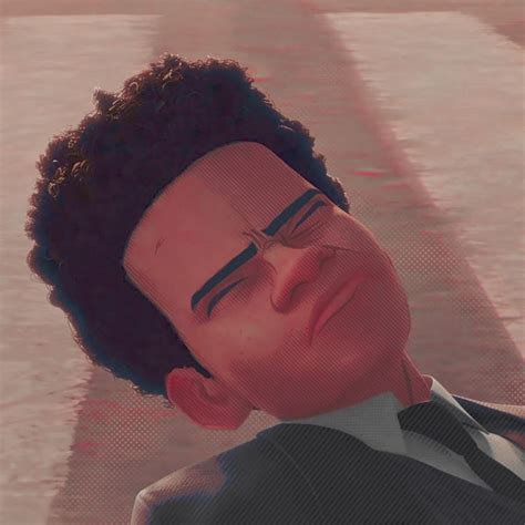 a man in a suit and tie with his head tilted to the side, wearing a ...