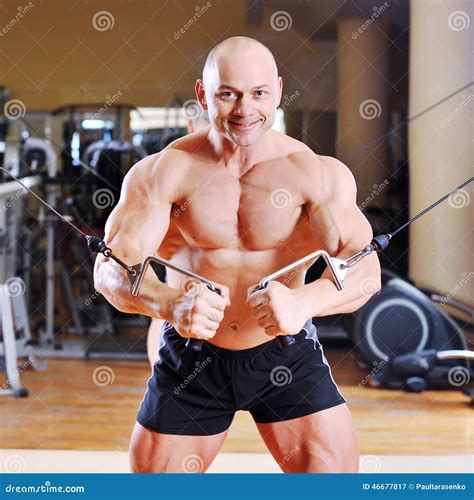 Bodybuilder Training Chest on Simulator Stock Image - Image of male