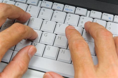 Hands Typing on Laptop Keyboard