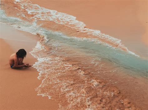 Premium Photo | Side view of shirtless girl sitting on beach