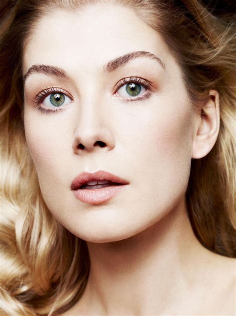 a woman with blonde hair and blue eyes is posing for a magazine cover ...
