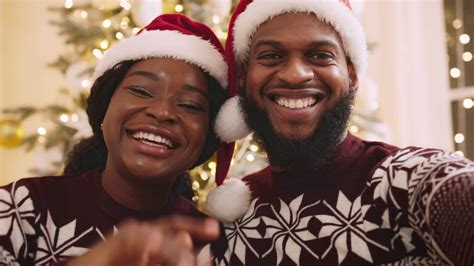 Christmas greeting for social media. Young african american couple in