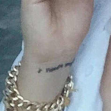 Kali Uchis Writing Wrist Tattoo | Steal Her Style