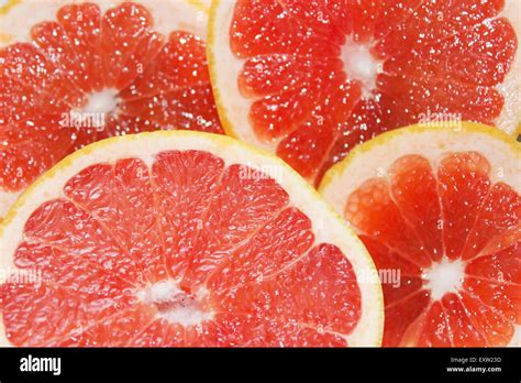 grapefruit bright red  cut  segments stock photo alamy