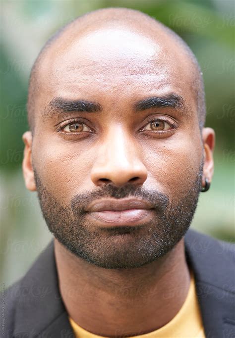 confident handsome black man  green eyes  stocksy contributor