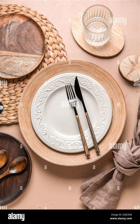 beautiful table setting  plates cutlery  glass  water
