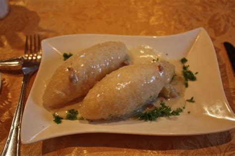 cepelinai. They are potato dough stuffed with meat, cheese or mushrooms ...