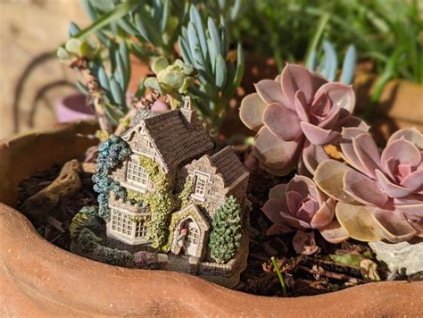 my partner collects Lilliput Lane houses and started putting them in