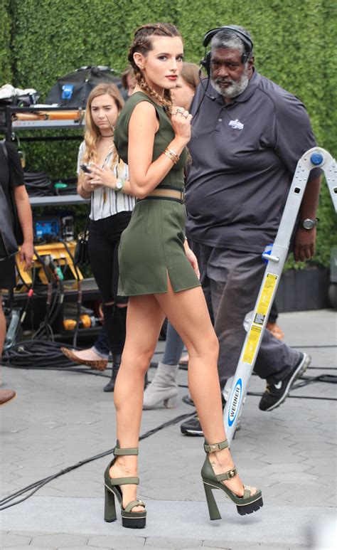 Bella Thorne in Tiny Mini Skirt and Huge Heels on the Set of Extra in