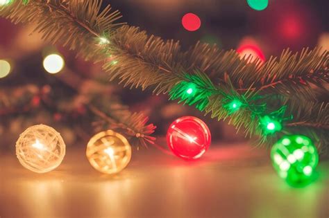 Premium Photo | A christmas tree with lights and a red ball