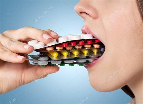 Girl eating lots of pills — Stock Photo © billiondigital #118522496