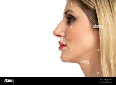 Profile portrait of a young woman with a humpbacked nose on a white
