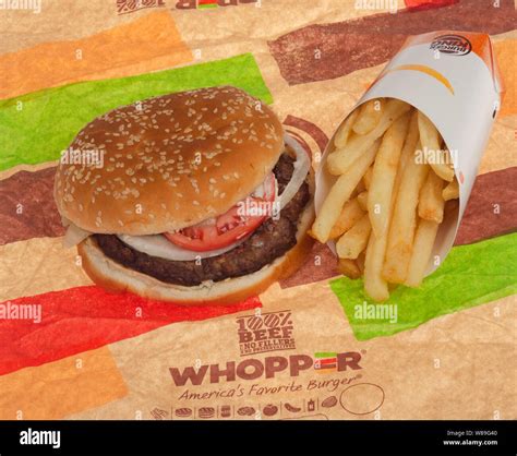 Burger King Beff Whopper with french fries on wrapper Stock Photo - Alamy