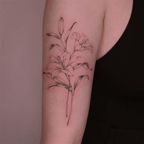 lily flowers tattoos arm