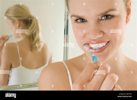 Female beauty brushing teeth Stock Photo - Alamy