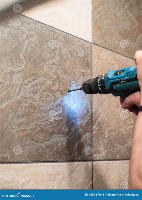 Repairer Drilling Wall Tiles with Electric Drill Stock Image - Image of