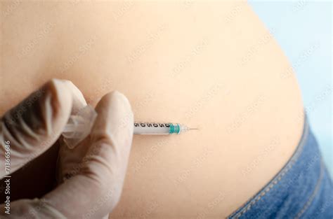 Syringe with needle for insulin isolated on light blue background with ...