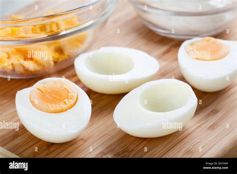 hard boiled eggs cut    yolk  bowl stock photo alamy