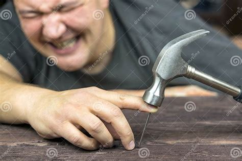 man hit  finger   hammer stock photo image  improvement