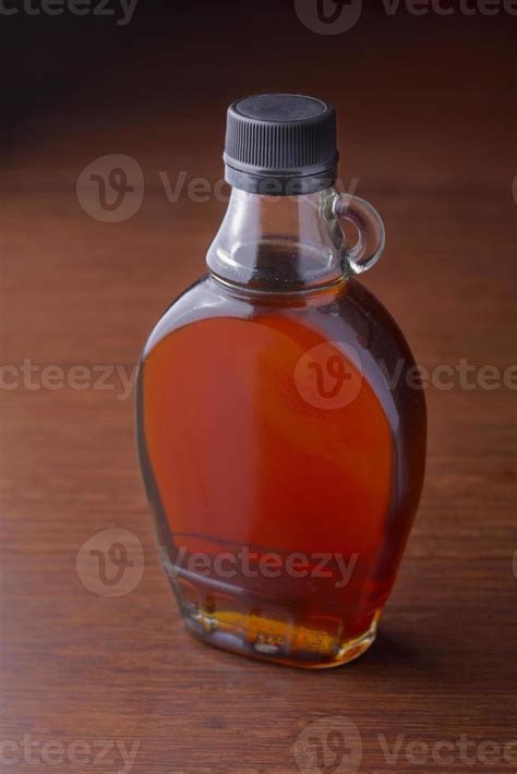 maple syrup on a dark background 14406281 Stock Photo at Vecteezy