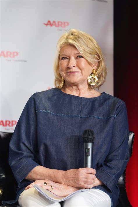 Martha Stewart Stacks Wine Glasses While Dining at a Restaurant in Photos