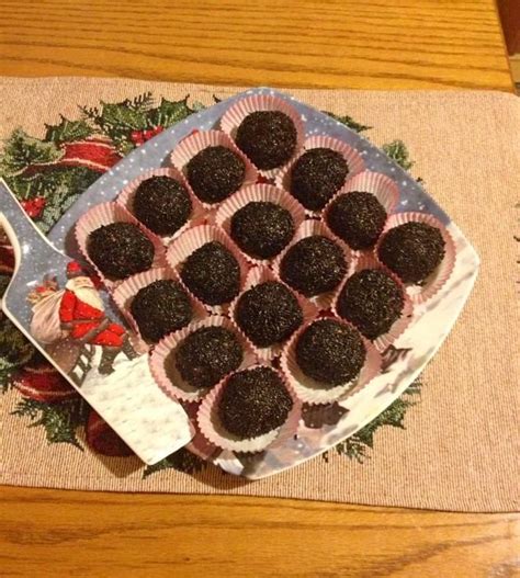 there is a plate of chocolate truffles on the table