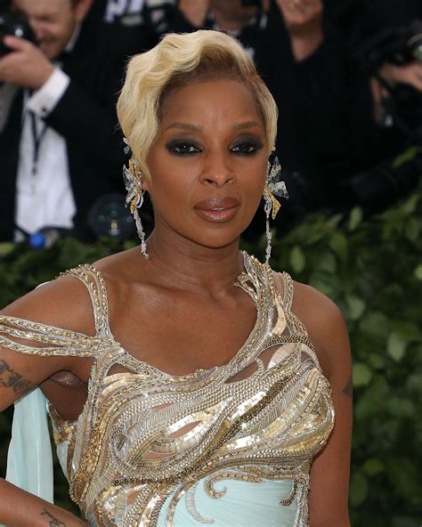 Mary J Blige Stuns with Her Snatched Body & Tattoos in Skimpy White