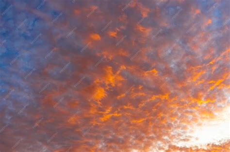 premium photo blue sky  orange clouds  sunset