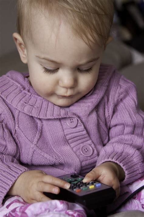 Baby boy with TV remote stock photo. Image of watch, child - 19347960