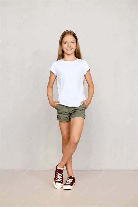 Premium Photo | Full length portrait of positive teenager girl standing