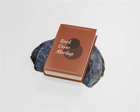 Макет обложки книги в мягкой обложке на скале | Премиум PSD Файл