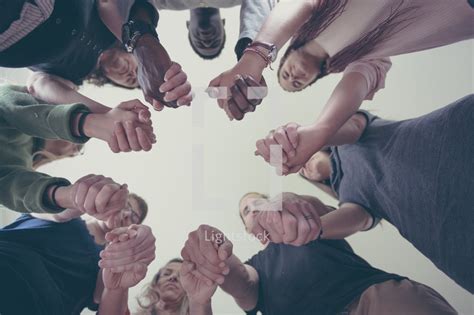 group holding hands   prayer circle photo lightstock