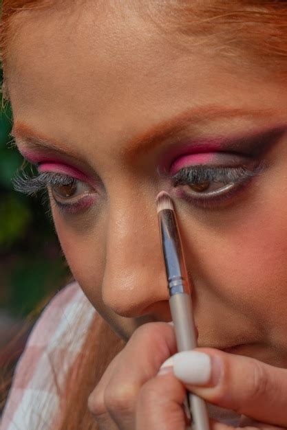 Premium Photo | A young mexican dancer adjusts her dress and prepares her makeup for a ...